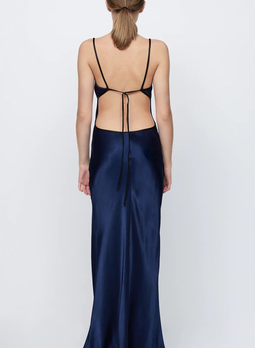 Hire the Bec and Bridge Cedar City Maxi Dress. A navy silk satin deep V dress with open back.